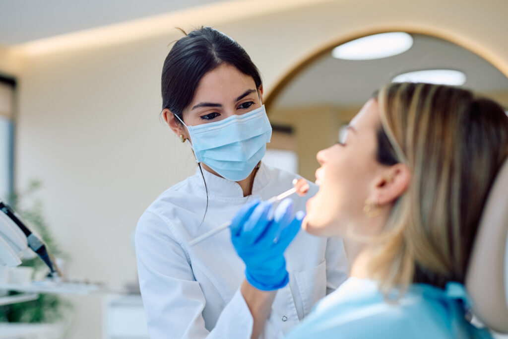 A dentist performing a comprehensive dental exam