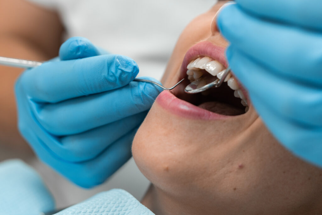 Patient being examined by the dentist
