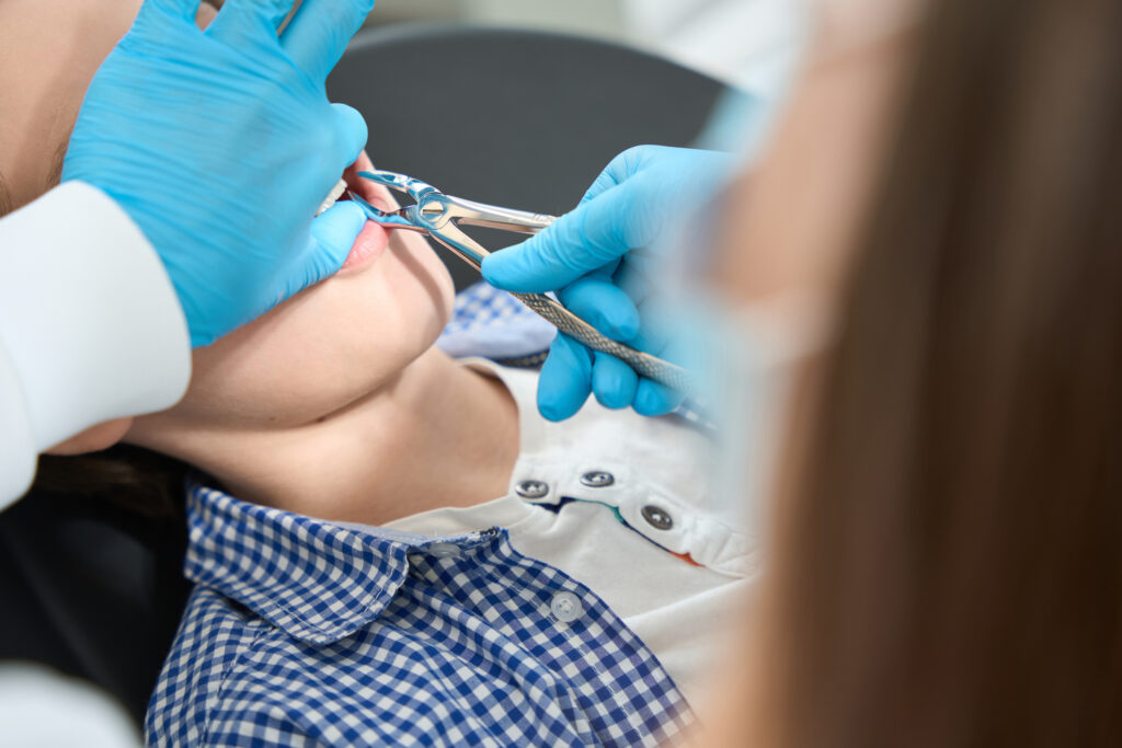 Patient having a tooth extracted