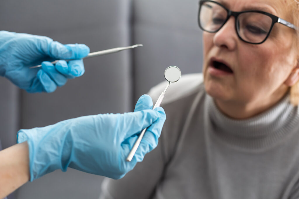 Patient being examined for oral cancer
