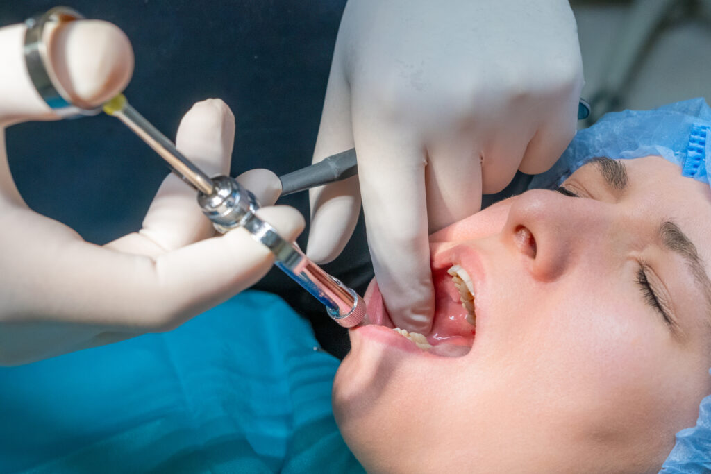 Patient receiving local anesthetic for a dental procedure