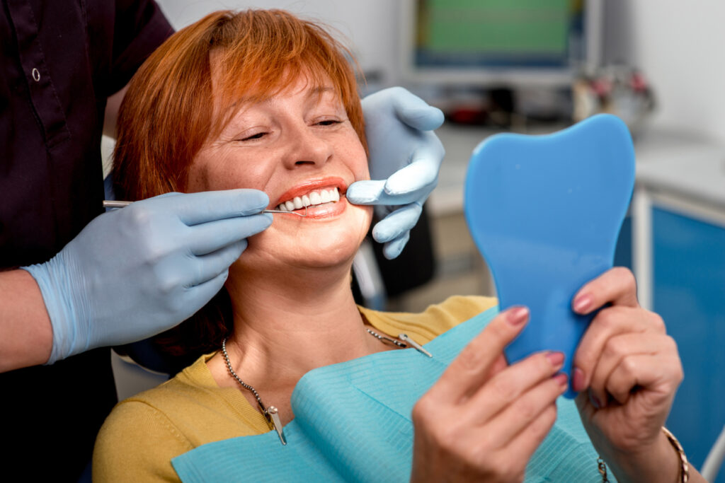 Female dental patient receiving a dental cleaning