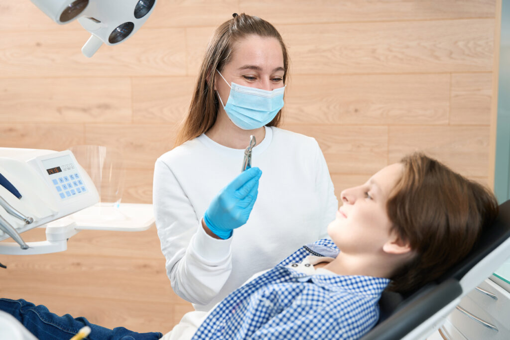 Dentist performing a tooth extraction